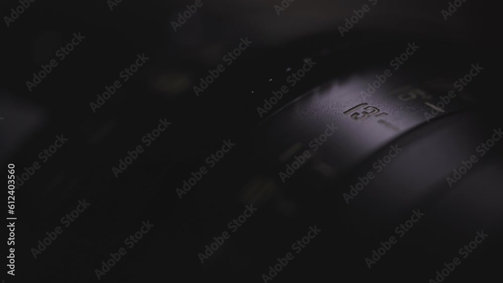 camera lens close-up of the dial with blue light in the background and blurred lens background, anamorphic lens, macro photography, video art