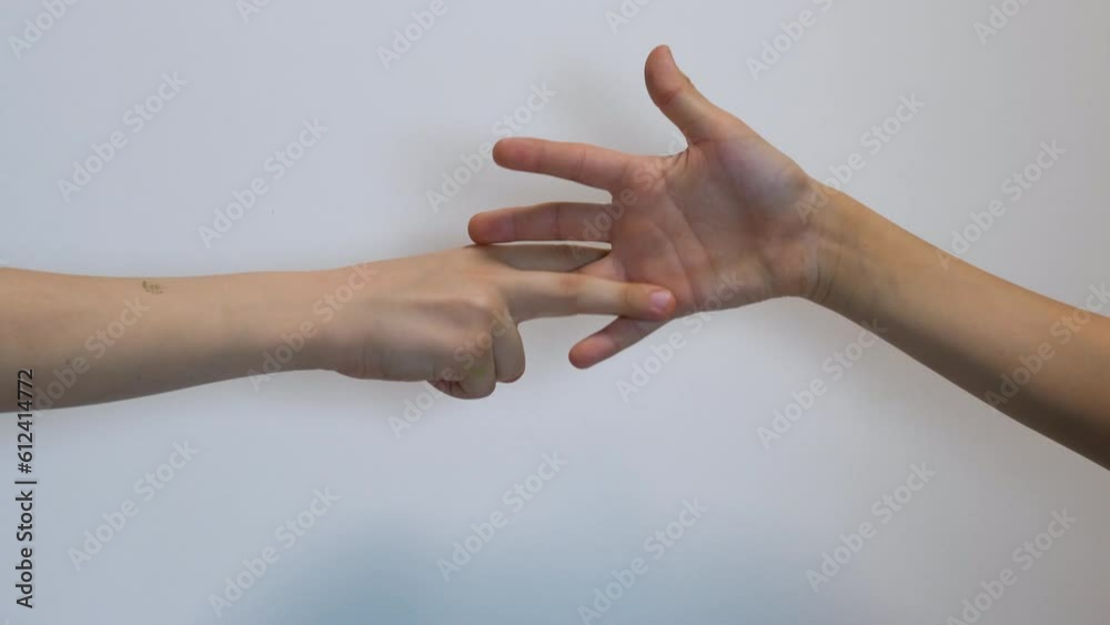 stone scissors paper hand gestures of children in a children's counting rhyme. children's games and competitions, draw in the children's competition stone scissors paper hand gestures of children in a children's counting rhyme. children's games and competitions, draw in the children's competition