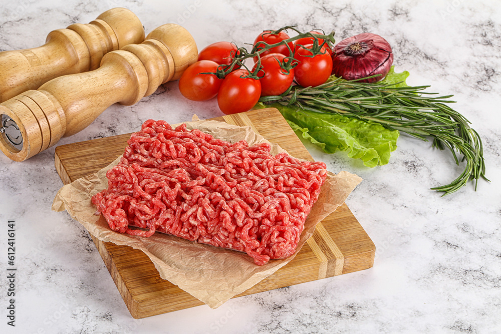 Raw minced beef meat on cutting board Raw minced beef meat on cutting board