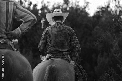 Εκτύπωση καμβά Cowboys horseback for ranching western lifestyle in Texas black and white during summer