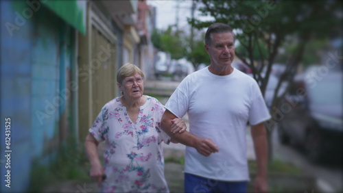 Supportive Walk of Adult Son Assisting Elderly Mother  Embracing Domestic Lifestyle Bond in Sidewalk Stroll
