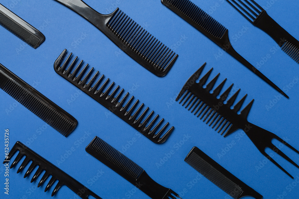 Professional combs and hairdresser tools on color background, top view Professional combs and hairdresser tools on color background, top view