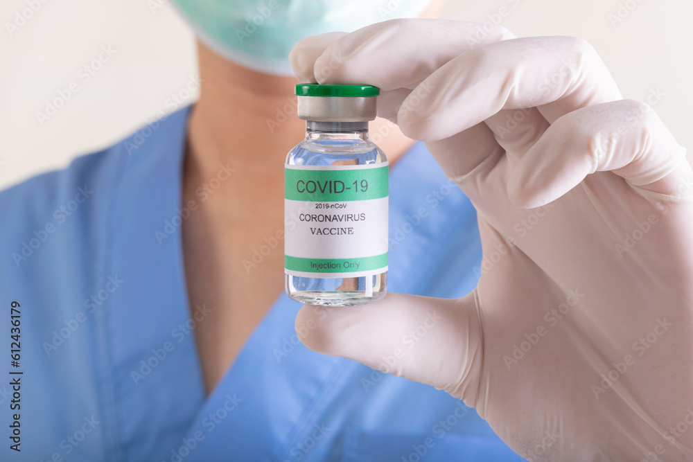 Doctors holding a bottle of covid-19 Coronavirus Doctors holding a bottle of covid-19 Coronavirus