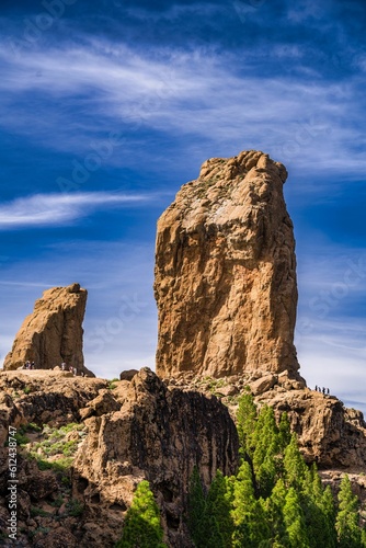 Vertical shot of the Roque Nublo under a cloudy sky on a sunny day, Gran Canary, Spain