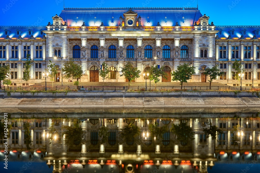 Beautiful shot of Bucharest Court of Appeal illuminated by lights during the evening