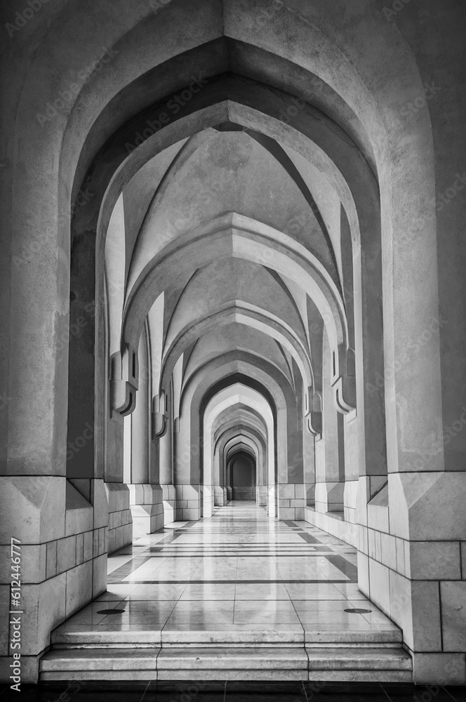 Vertical shot of traditional archway in Muscat. Black and white