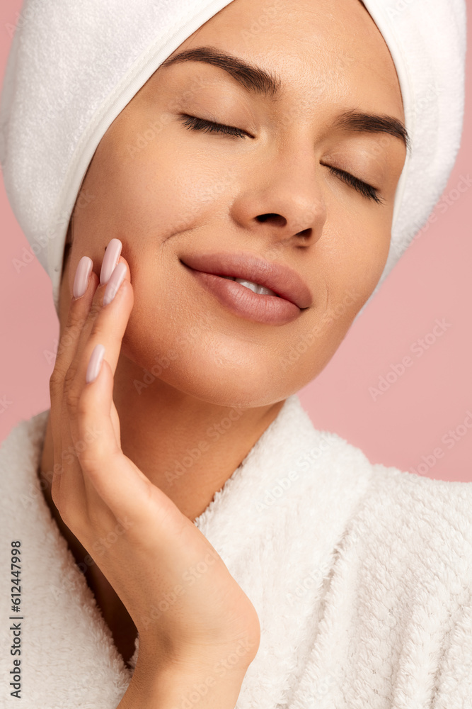 Sensual woman applying cosmetic product on cheek after shower Sensual woman applying cosmetic product on cheek after shower
