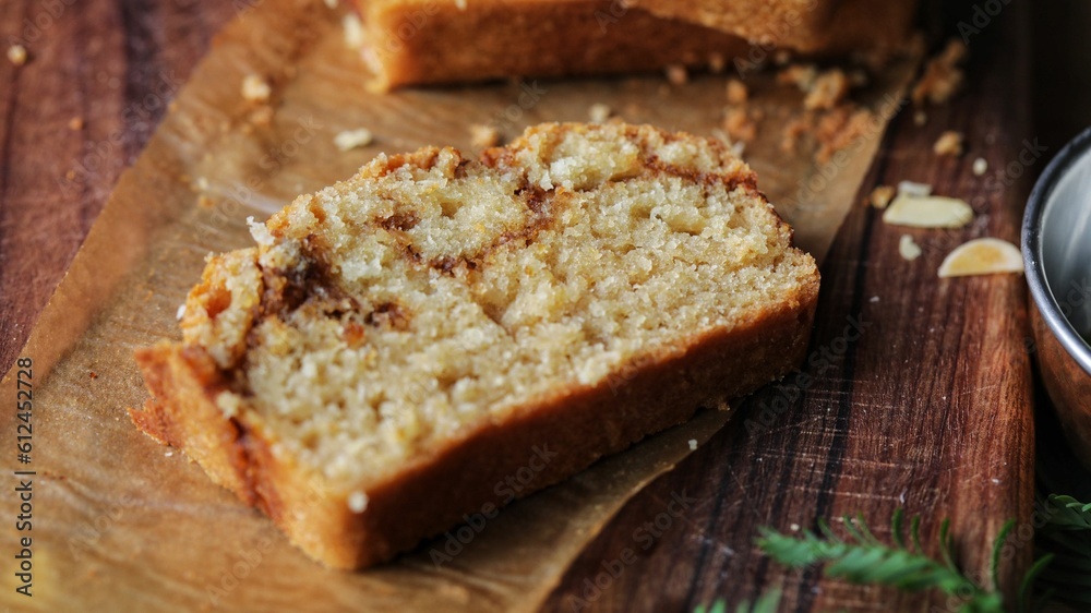 Closeup shot of the sweet egg-free bread made with cinnamon and topped with almond flakes