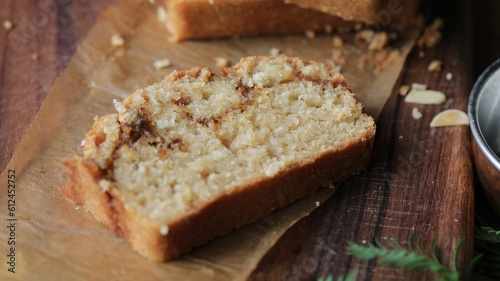 Closeup shot of the sweet egg-free bread made with cinnamon and topped with almond flakes photo