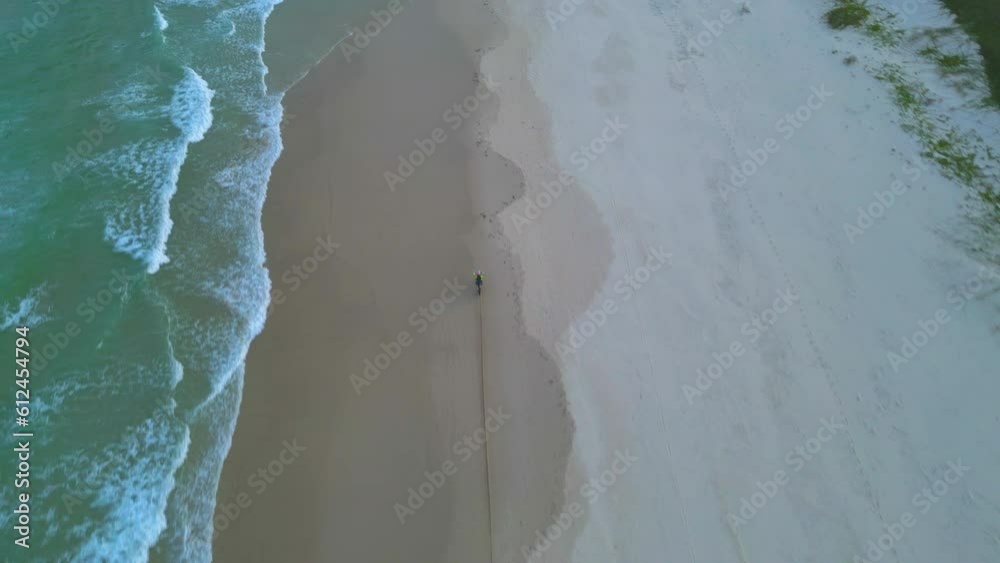 Drone shot of a motorbike on Maggies Beach in Northern New South Wales, Australia. Drone shot of a motorbike on Maggies Beach in Northern New South Wales, Australia.