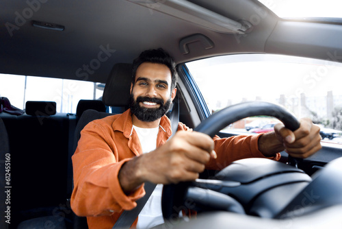 Joyful Middle Eastern Man Smiling Posing Driving New Vehicle