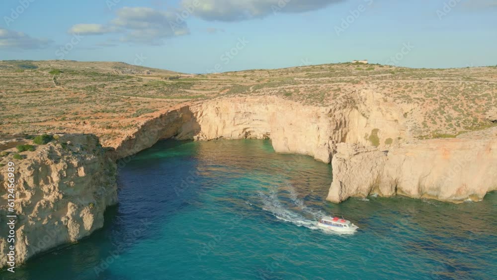 High-angle view of Blue Lagoon on Comino island during the sunset. High-angle view of Blue Lagoon on Comino island during the sunset.