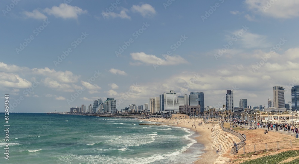 Beautiful landscape of a sandy beach and tall buildings