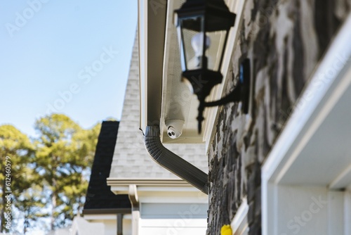 A black street lamp on a house in a suburban area photo