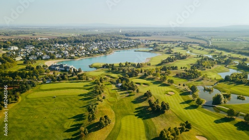 Картината върху платно Drone view of water bodies surrounded by greenery and buildings in Oberwaltersdo