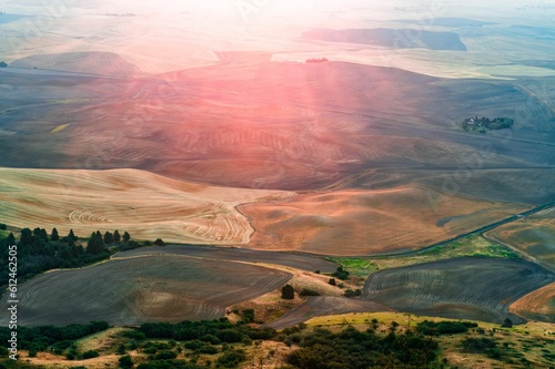 Beautiful view of a farmland covered with sunrays