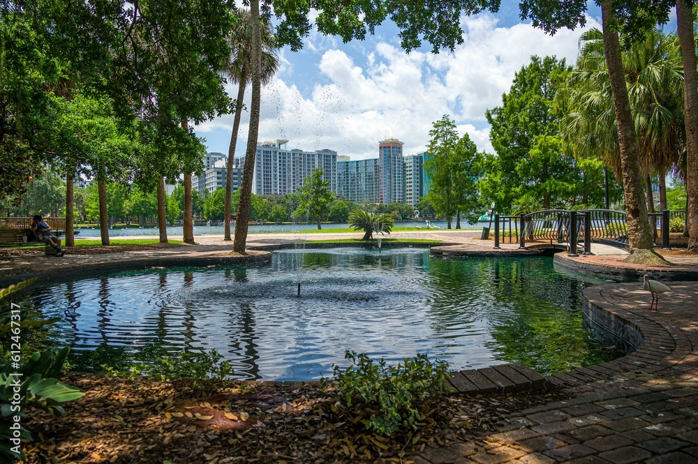 Beautiful park with a small bridge over an artificial lake Beautiful park with a small bridge over an artificial lake