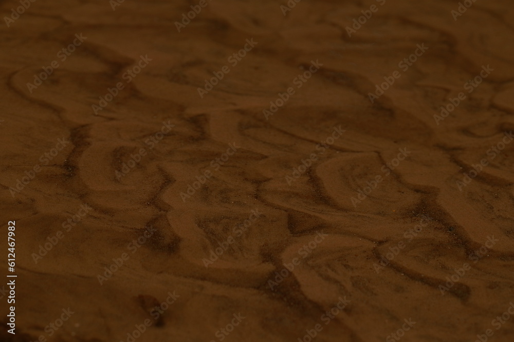 Sandy creek bottom, waves and ripples in shallow water