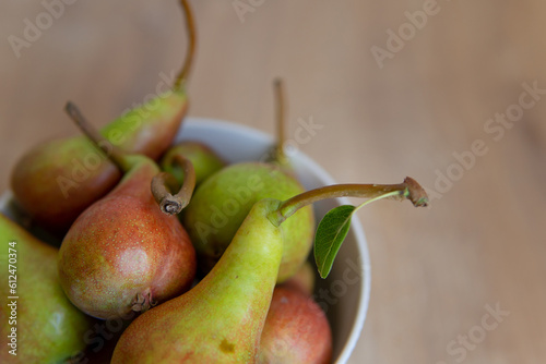 pears in a bowl close up with blurred background