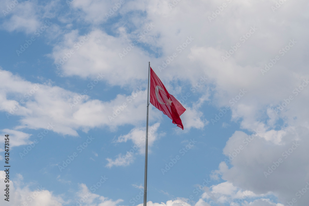 Turkish flag waving in the cloudy sky Turkish flag waving in the cloudy sky