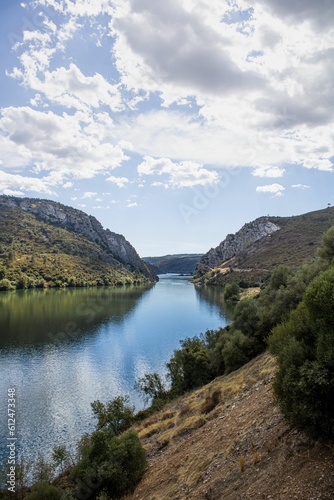 Beautiful landscape of a river between green hills on a sunny day