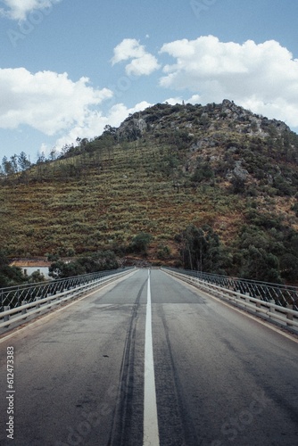 Asphalt road in a mountainous road in the morning © Rafael Moraes/Wirestock Creators