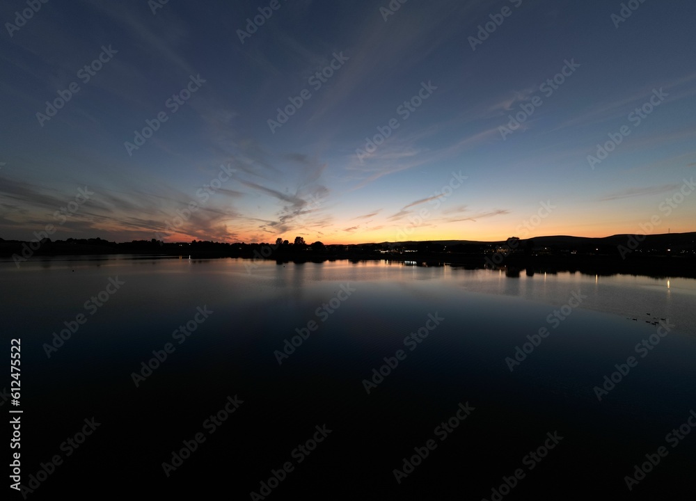 Beuatiful shot of the sunset sky over the Hollingworth Lake