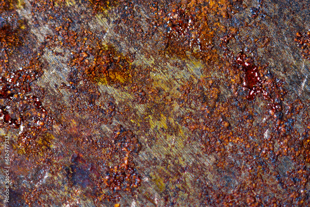 Macro photography of orange rust of rusty iron steel metal plate texture Macro photography of orange rust of rusty iron steel metal plate texture