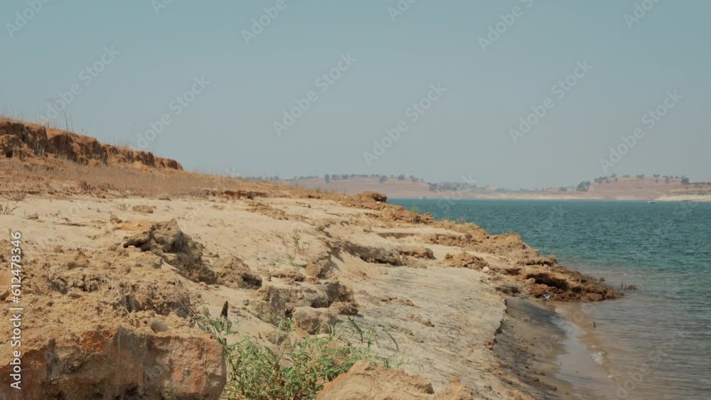 Empty rocky coast with calm sea and cloudless sky Empty rocky coast with calm sea and cloudless sky