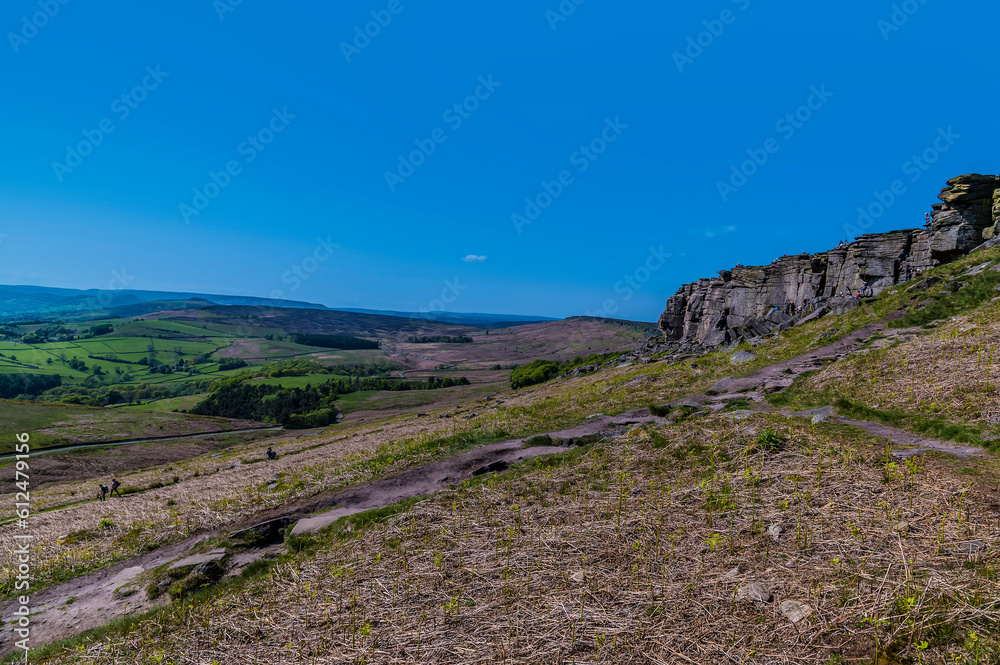 A view from the path leading down from the Stanage Edge escarpment in the Peak District, UK in summertime