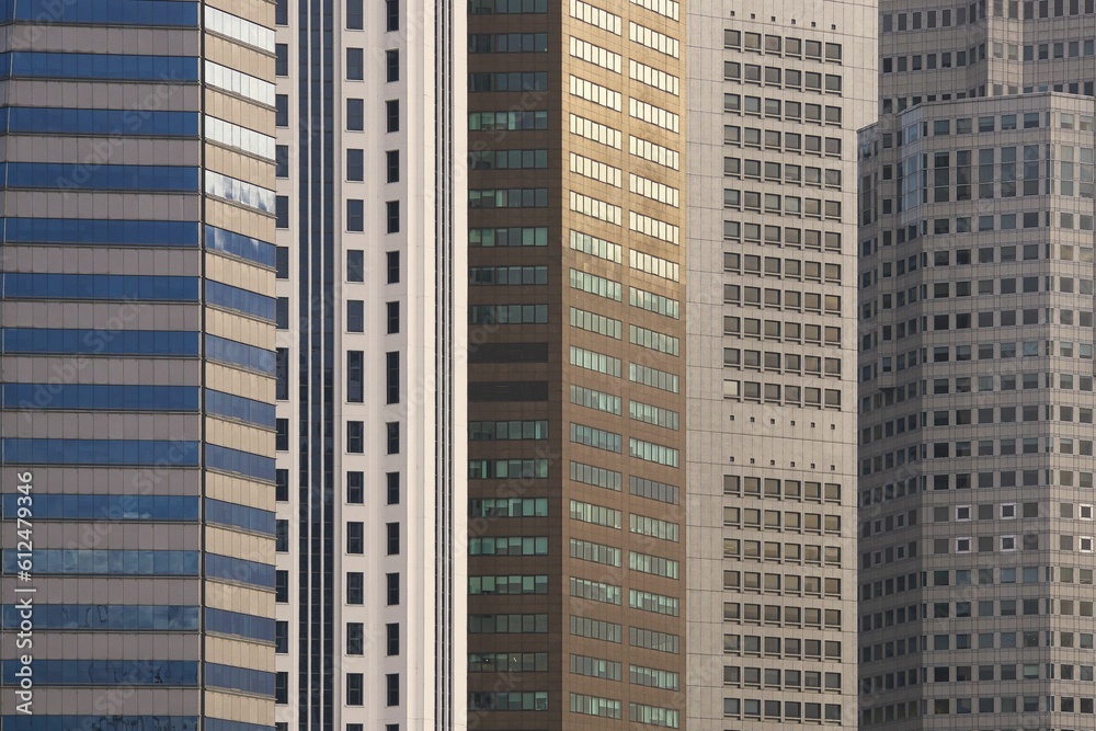Close-up shot of high rise buildings and skyscrapers in the city during golden hour
