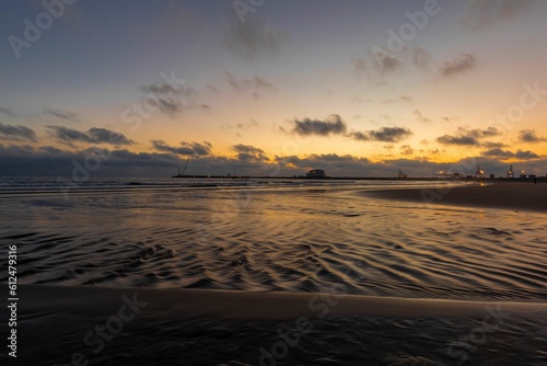 Beautiful shot of the sunset over the sea © Tiago Marçal/Wirestock Creators