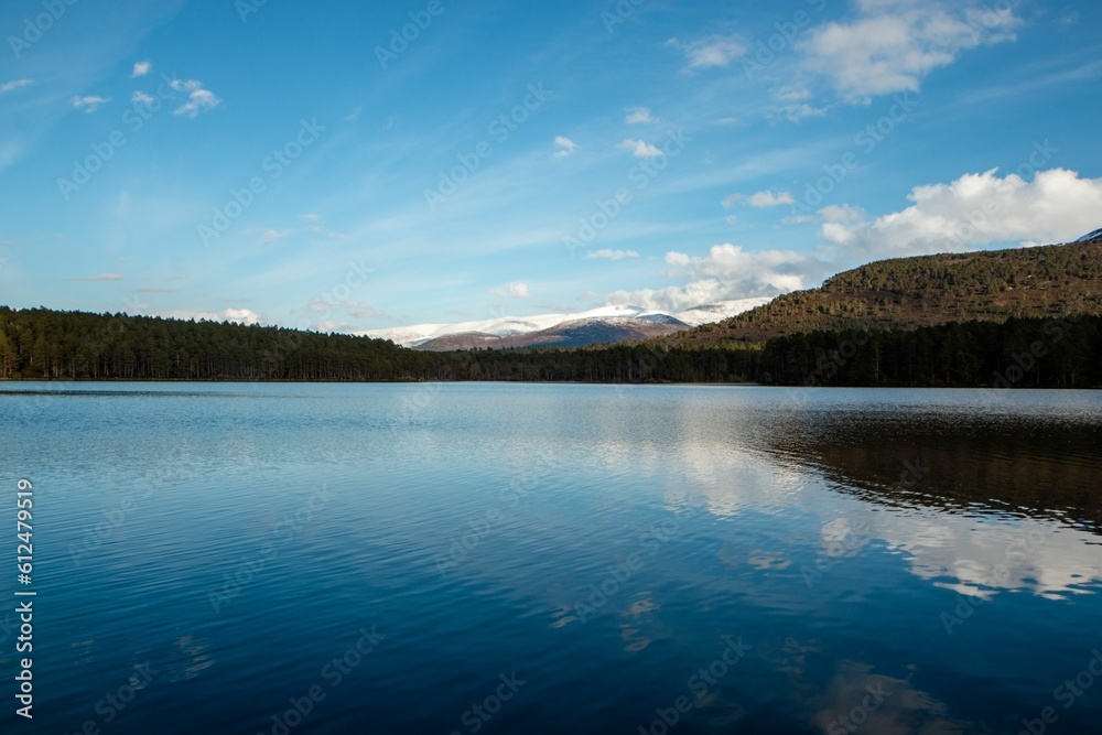 Beautiful view of the lake near the mountains in Cairngorms, Scotland