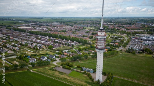A Gerbrandy Tower next to a city and greenfield