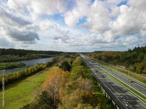 Aerial of a highway alongside a river in Utrechtse Heuvelrug the Netherlands during the daytime