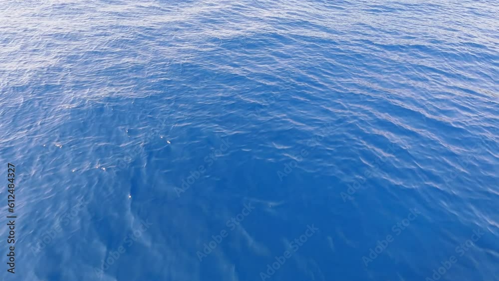 Aerial view of turquoise sea water with rolling waves in Lefkada, Cephalonia, Greece