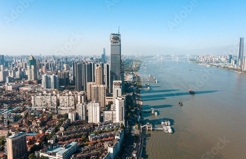 Aerial view of Shanghai cityscape and the Huangpu River on blue sky background in China © Zhou Chenxiao/Wirestock Creators