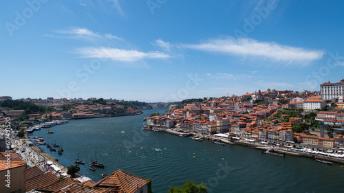 Fototapeta Naklejka Na Ścianę i Meble -  View of the Douro river from above with blue sky in summer. Porto, Portugal.