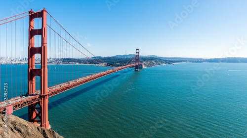 Drone view of the Golden Gate Bridge over the turquoise ocean in San Francisco, California, USA