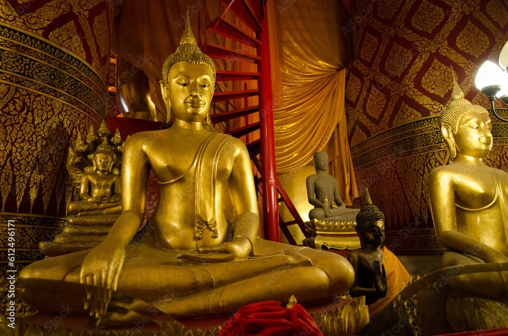 Golden Buddhas inside the Wat Phanan Choeng in Ayutthaya, Thailand