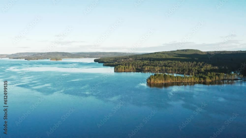 Aerial view of a lake with forested hills Aerial view of a lake with forested hills