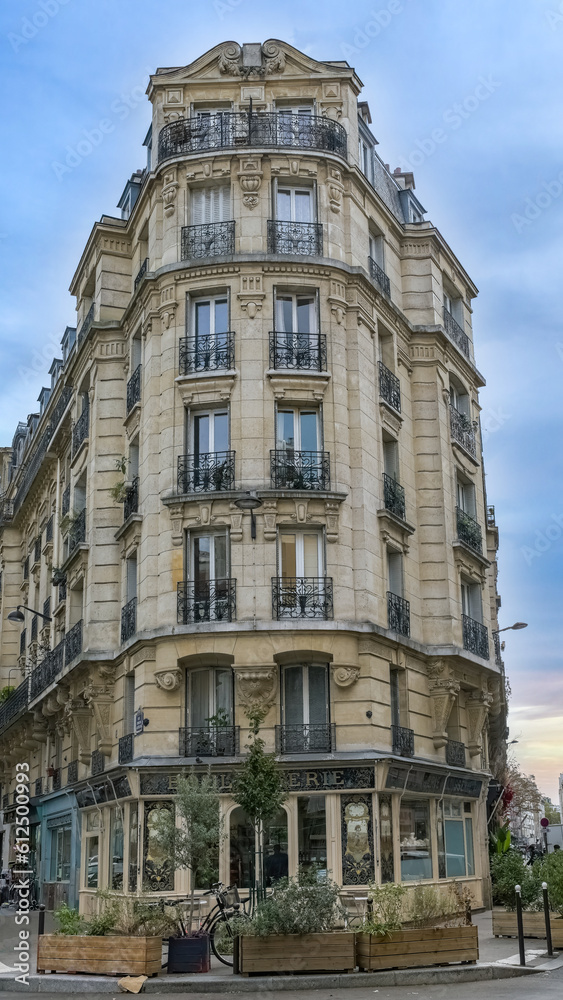 Paris, ancient buildings avenue Daumesnil, typical facades and windows, with a bakery
