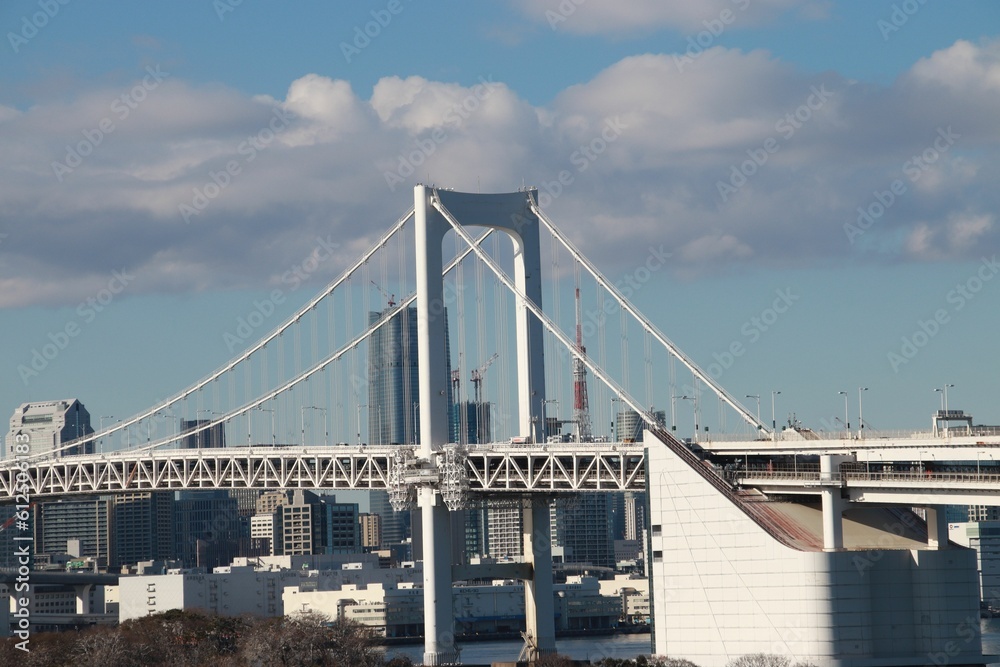 Rainbow Bridge in Tokyo, Japan against a blue sky Rainbow Bridge in Tokyo, Japan against a blue sky