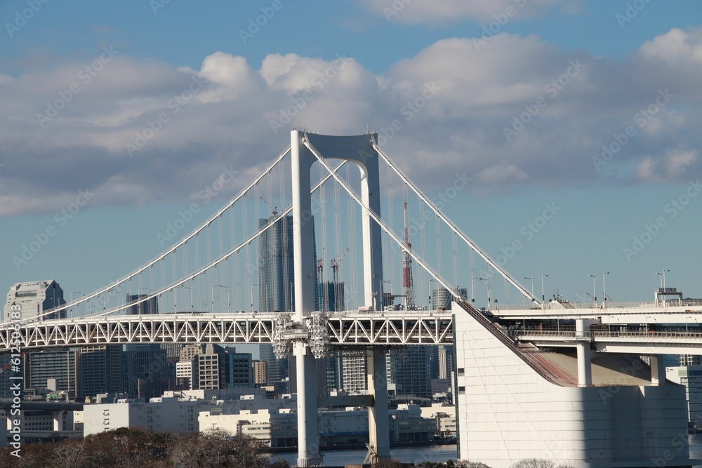 Rainbow Bridge in Tokyo, Japan against a blue sky