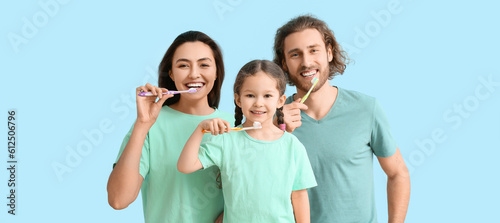 Happy family brushing teeth...