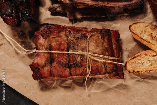 Closuep shot of freshly grilled barbecue with olives on the blurred background photo