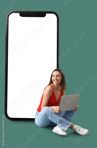 Happy young woman with lapt...