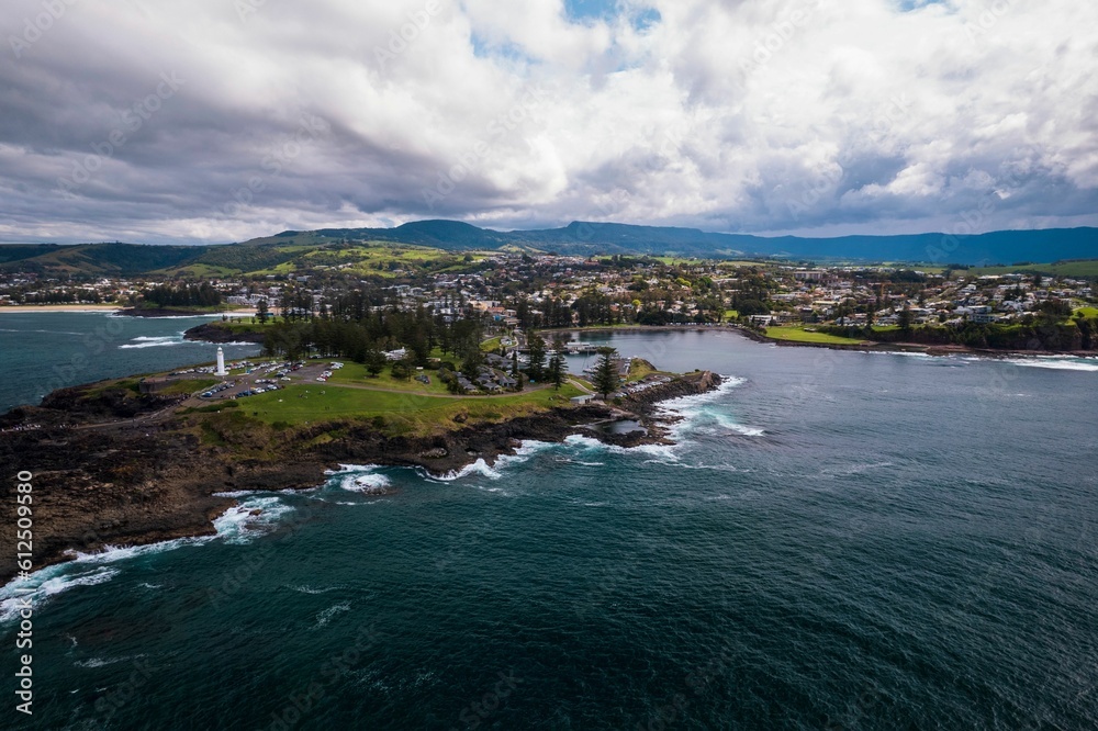 Drone view of the Pacific Ocean and islands with Kiama Lighthouse in New South Wales, Australia