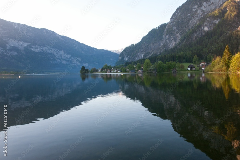 Aerial view of Hallstatt lake surrounded by dense trees