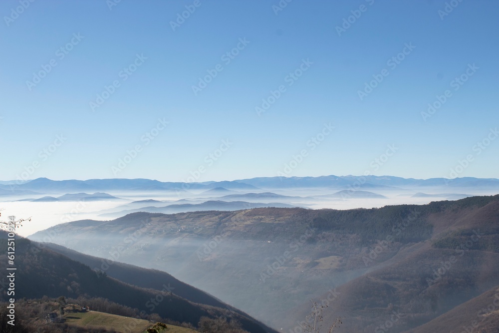 Landscape view of the mountains and hills against a blue sky in Sarajevo